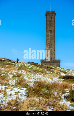 Holcombe Hill, Lancashire, UK. 1st February, 2018. Beautiful cold, crisp and sunny weather on the first day of February at Holcombe Hill, near Bury, Lancashire, as a dusting of snow covers the hill top near the Peel Monument. Built in 1852 this well known Bury landmark was erected in tribute to one of Bury's most famous sons, Sir Robert Peel; founder of the Police force and Prime Minister 1841-1846. Picture by Paul Heyes, Thursday February 01, 2018. Credit: Paul Heyes/Alamy Live News Stock Photo