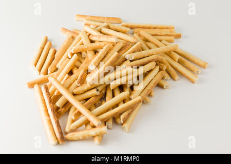 Crispy flour sticks lined on a white background Stock Photo