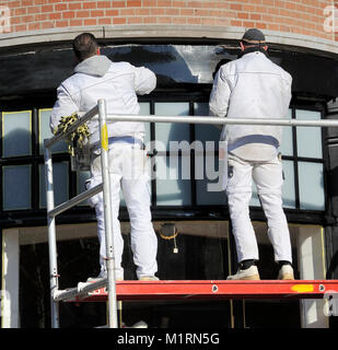 Amsterdam, Holland-February 5, 2015;Two painters working outside at a scaffold.February 5, 2015 Amsterdam