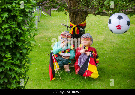 Berlin, Germany - July 2, 2016: German football fans decorated their garden with flags and balls looking forward to watch soccer match and celebrate Stock Photo