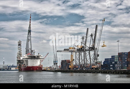 big cranes in dutch harbor,he container cranes at Maasvlakte 2 in the port of Rotterdam are unmanned and practically fully automated. Robots Stock Photo