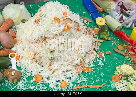 Various sliced vegetables on a pile after the demonstrations of cutting blades. Stock Photo