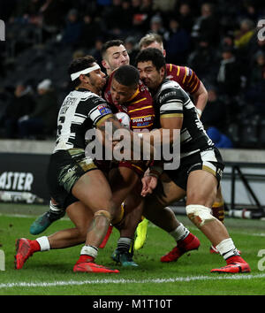 Hull FC's Bureta Faraimo (right) and Albert Kelly (left) tackle Huddersfield Giants' Jordan Turner during the Betfred Super League match at the KCOM Stadium, Hull. Stock Photo