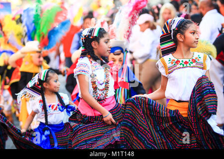 mexican girls dressed with traditional mexican folk costumes handmade skirt with mexican patterns, mexican carnival, editorial use only Stock Photo