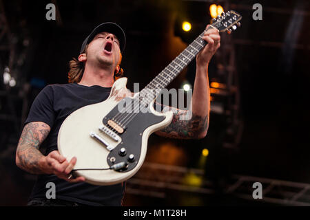 The Swedish punk rock band Millencolin performs a live concert at Koengen in Bergen. Here guitarist Mathias Färm is seen live on stage. Norway, 19/06 2011. Stock Photo