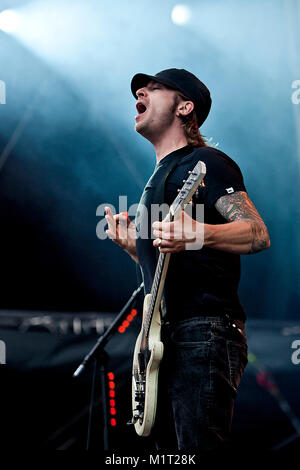 The Swedish punk rock band Millencolin performs a live concert at Koengen in Bergen. Here guitarist Mathias Färm is seen live on stage. Norway, 19/06 2011. Stock Photo