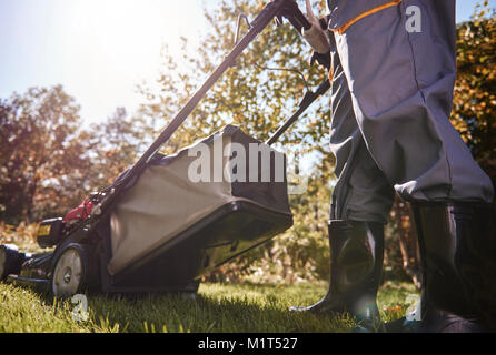 Unrecognizable man cutting the grass Stock Photo