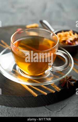 Cup of hot apple tea with spices Stock Photo