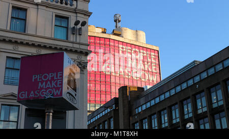 Glasgow, Scotland / United Kingdom - 01/02/2018 - A pole showing the slogan  "People Make Glasgow" with the same sign on a building in the background Stock Photo