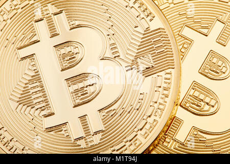 Golden Bitcoin background, two coins Stock Photo