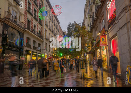MADRID, SPAIN - DECEMBER 31, 2017: Scene of Montera street, with Christmas decoration, locals and visitors, in Madrid, Spain Stock Photo