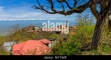 city of Signakhi in the mountains of Georgia, red tile roofs of brick houses against the background of the Alazani valley and snow-covered tops of mou Stock Photo