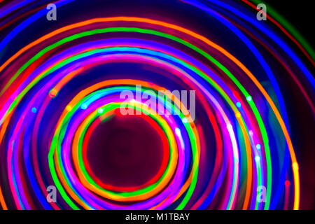 Neon circles, LED Lights Long Exposure, LED Lighting in blue, red, green, pink, cyan and magenta on nlack nackground Stock Photo