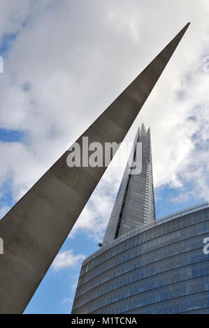 the Southwark needle sculpture with the shard and news building in an abstract different and unusual angle or viewpoint of these iconic London sites. Stock Photo