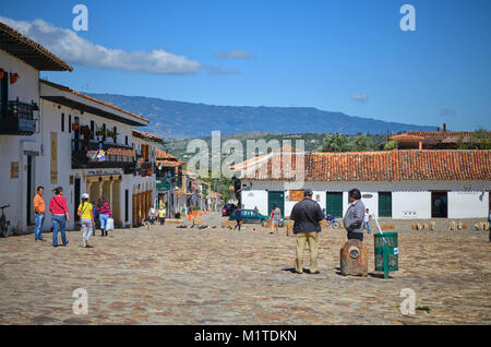 BOYACA, COLOMBIA - JANUARY 23, 2014: A view of some buildings and mountains from the main square of Villa de Leyva, Colombia. Stock Photo