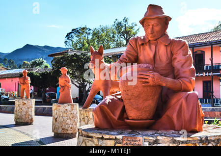 BOYACA, COLOMBIA - JANUARY 23, 2014: Several amazing ceramic sculptures next to the church in the main square of Raquira. Stock Photo