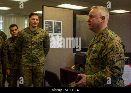 Col. Ricardo Martinez, chief of staff, Marine Air Ground Task Force Training Command, Marine Corps Air Ground Combat Center, speaks with Marines of the Fleet Assistance Program at the opening of the Tax Center aboard MCAGCC, Jan. 29, 2018. The Tax Center offers free assistance to Marines during Tax season. (U.S. Marine Corps Stock Photo