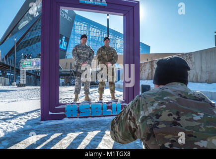 Minnesota police officers and Minnesota National Guard Soldiers take pictures together at US Bank Stadium in Minneapolis, Jan. 31, 2018. The Minnesota National Guard is working with local law enforcement to ensure a safe and secure Super Bowl experience for residents and visitors.  (Minnesota National Guard Stock Photo