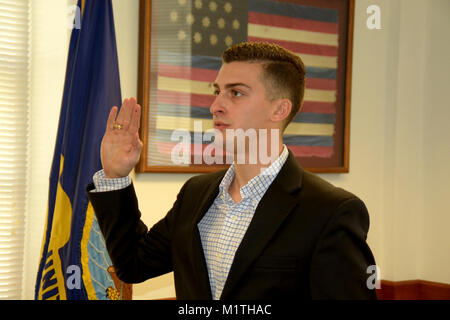 JOINT BASE SAN ANTONIO-FORT SAM HOUSTON – (Jan. 25, 2018) Patrick Simmons of Boerne, Texas, takes the Oath of Enlistment into America’s Navy at Navy Recruiting District (NRD) San Antonio.  Simmons, a 2017 graduate of Texas A&M University, will attend Officer Candidates School in February with follow-on training as a naval flight officer (NFO) at Naval Air Station Pensacola.  As a NFO, Simmons will study aerodynamics, aircraft engine systems, meteorology, navigation, flight planning, and flight safety.  (U.S. Navy Stock Photo