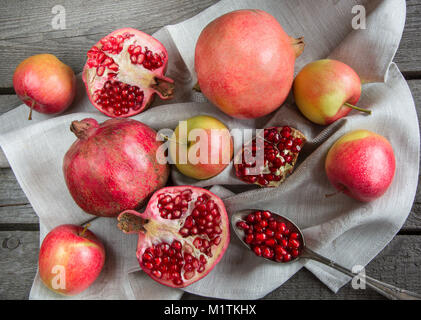 Still life of autumn fruits, pomegranates, grapes, apples. Vintage Flat lay Stock Photo