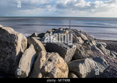 Rock sea defences on the beach at Sidmouth, Devon, England, UK. Stock Photo