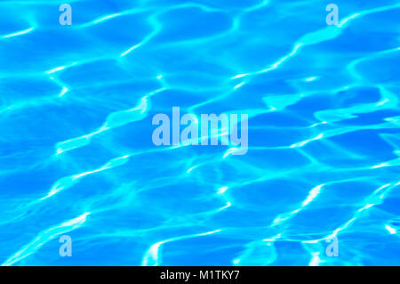 Ripples of sunlight reflecting in water. Ideal for use as a background - John Gollop Stock Photo