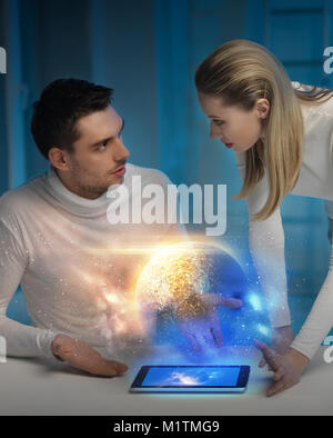 couple with tablet pc at space laboratory Stock Photo