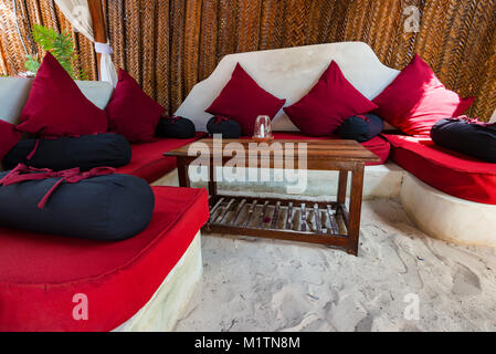 Beach cafe interior with wooden furniture Stock Photo