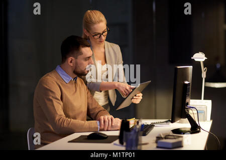 business team with tablet pc late at office Stock Photo