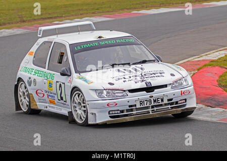 Peugeot 306 Maxi with driver Chris West and co-driver Harry Brown at the Motorsport News Circuit Rally Championship, Snetterton, Norfolk, UK. Stock Photo