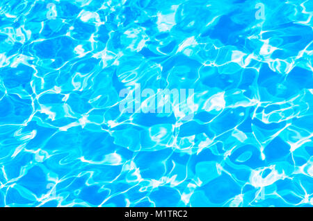 Ripples of sunlight reflecting in water. Ideal for use as a background - John Gollop Stock Photo