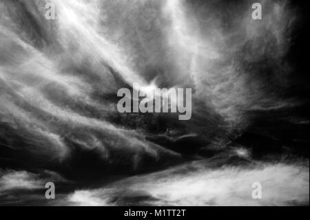 Cirrus clouds wisps of light clouds with natural patterns in black and white. Stock Photo