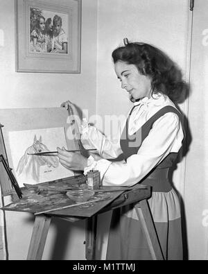 Elizabeth Taylor painting Man-O-War, circa 1944. Photo of Her and brother Howard on the wall. Stock Photo