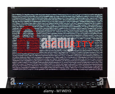 Security text with red lock over encrypted text on a laptop screen against a white background - cyber crime Stock Photo