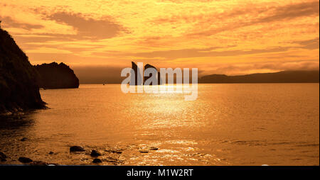 Kamchatka Peninsula scenery seascape at sunset: view of beautiful islands Three Brothers Rocks in Avachinskaya Bay (Avacha Bay). Eurasia, Russian Far  Stock Photo