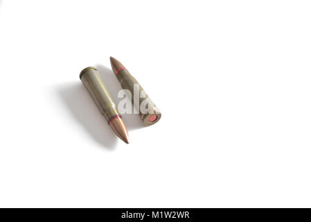 Two rifle bullets isolated on a white background. Military ammunition Stock Photo