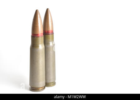 Two rifle bullets isolated on a white background. Military ammunition Stock Photo