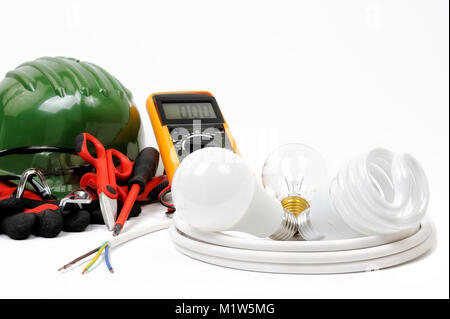 Safety equipment, work tools and components for a residential electrical installation, photographed on a white background. Stock Photo