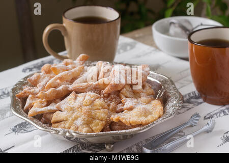 Angel wings biscuits, a traditional European sweet dish for carnival. Rustic style. Stock Photo