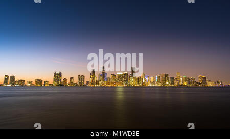 USA, Florida, Dawning atmosphere over the skyline of the city miami from water with light reflections and stars Stock Photo