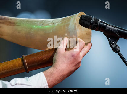 Dortmund, Germany. 2nd Feb, 2018. Immo Ortlepp from Wedemark blows into his instruments at the 20th German Championship of Stag-Calling in Dortmund, Germany, 2 February 2018. The art of stag-calling is part of the traditional vocation of the huntsman. Credit: Bernd Thissen/dpa/Alamy Live News Stock Photo