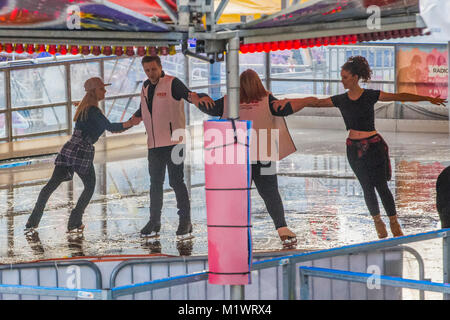 Leeds. UK. 2nd February, 2018. Yorkshire's favourite winter attraction the Ice Cube in Millenium Square, Leeds, was opened on 2 February 2018.  Radio Aire breakfast presenters Caroline & Ant opened the attraction in style as they bravely took to the ice to perform an opening dance after some intense training from former British ice dance champion Jennifer Barnfield-Lee Credit: James Copeland/Alamy Live News Stock Photo