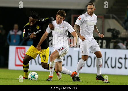 Cologne, Germany. 2nd Feb, 2018. Dortmund's Michy Batshuayi (L) vies with Cologne's Dominique Heintz (C) during the Bundesliga soccer match between FC Cologne vs Borussia Dortmund in Cologne, Germany, Feb. 2, 2018. Credit: Joachim Bywaletz/Xinhua/Alamy Live News Stock Photo