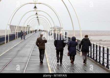 Southport, Merseyside, UK 3rd February 2018. UK Weather.  Damp, dark, drizzly day at the coast as local residents take light exercise on the seafront promenade. Credit: MediaWorldImages/AlamyLiveNews. Stock Photo