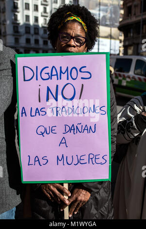 Madrid, Spain. 3rd Feb, 2018. A woman with a placard that reads 'Let's say no! to traditions that harm women' protesting against female genital mutilation in Madrid, Spain. Credit: Marcos del Mazo/Alamy Live News Stock Photo