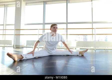 Guy doing drinking water before morning training.  Stock Photo