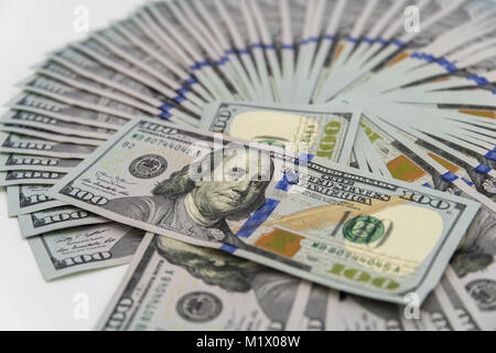 a stack of us 100 dollars cash with white background Stock Photo - Alamy
