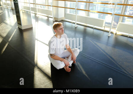 Guy doing drinking water before morning training.  Stock Photo