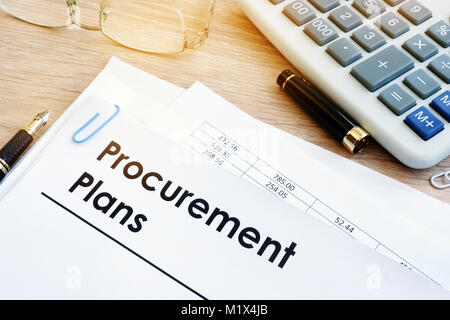 Pile of documents with title Procurement Plans. Stock Photo