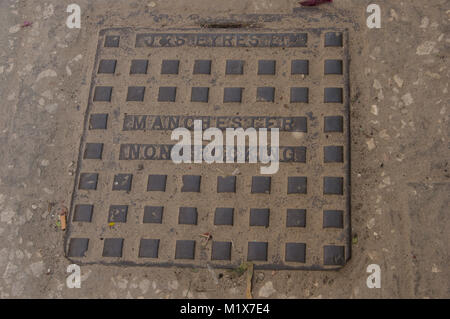 J & S Eyres Non Rocking Manchester square iron manhole cover on the street in Stone Town Zancibar City Zanzibar Tanzania